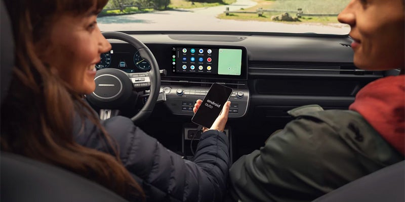 woman driving Hyundai Kona